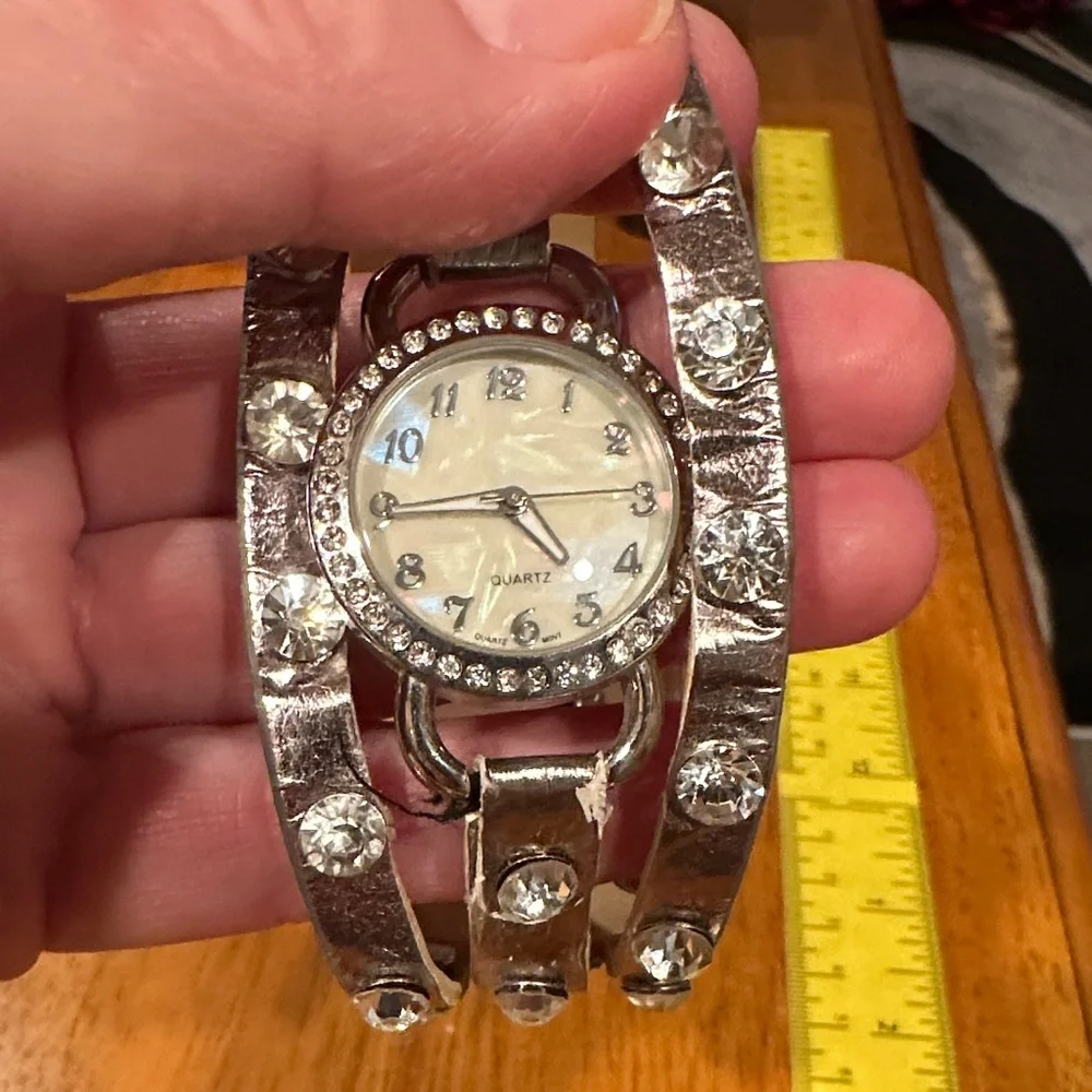 Silver Quartz Watch with Crystal Accents and MOP face. Snap closure